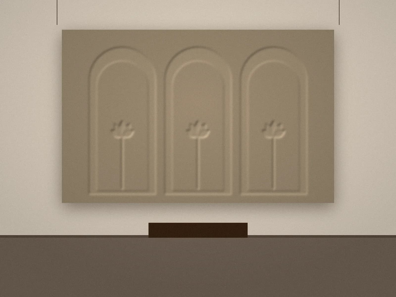 Sandstone-toned relief panel with three arches and lotus motifs in a lobby